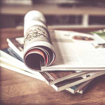 Printed booklets on a table, printed at a very low cost