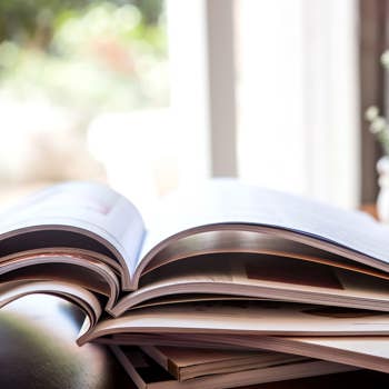 Printed booklet examples on a table, ordered and delivered at a very low cost