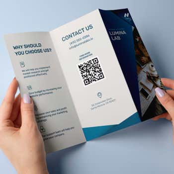 Business brochure in hands of a woman